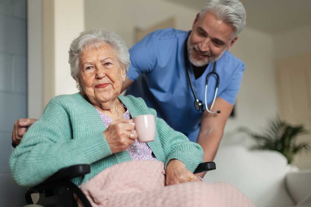 Older adult arranging familiar photos and belongings in a bright assisted living apartment.